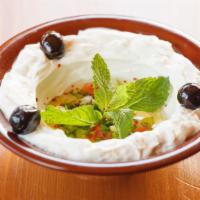 Labneh · Double sour cream served with mint and olive oil mixed with garlic.