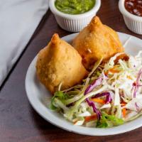 ~Vegetable Samosa · Stuffed with spiced potatoes and peas. 2 pieces.