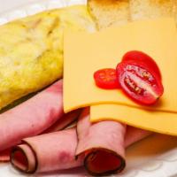 Ham & Cheese Omelet · 3 eggs folded with ham and cheese, includes toast on the side