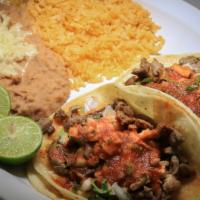 Taco Plate · Includes two tacos with rice and beans.