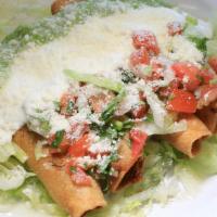 Chicken Taquitos · Lettuce, sour cream, guacamole, cheese, and pico. Only chicken.
