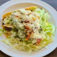 Tacos Dorados · Each. Hard shell tacos include lettuce, sour cream, guacamole, pico de gallo, and cheese.