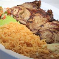 Plato De Carne Asada · Served with refried beans, rice, salad, and tortillas.