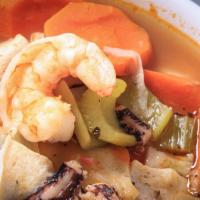 Caldo De Mariscos (7 Mares) · Seafood soup served with tortillas and rice.