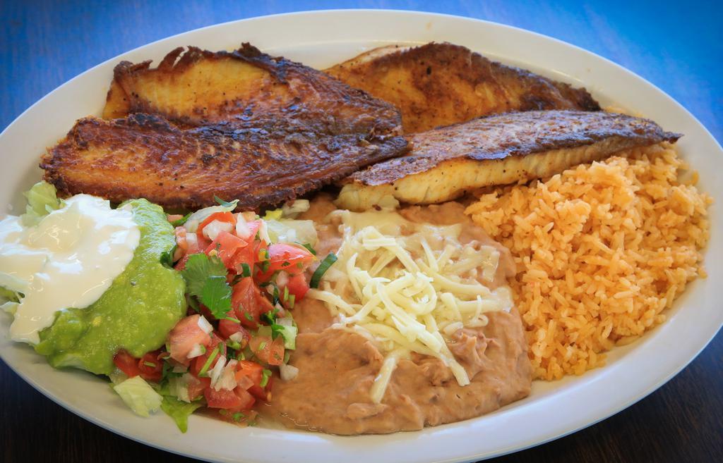Filete De Pescado · Served with refried beans, rice, salad, and tortillas