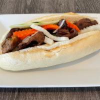 Banh Mi- Bánh Mì Thịt · Served On A Loaf Of French Bread W/ Pickle Daikon, Carrot, Cucumber, Cilantro, Onion, Jalape...