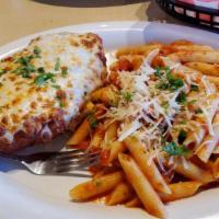 Chicken Parmesan · All natural chicken breast breaded with our house made crouton breading. Served with penne p...