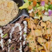 #12 Mix Shawarma Plate · Combo Chicken&Beef Shawarma Plate. 
Comes with grilled tomato, spicy pepper, salad, rice,
ch...