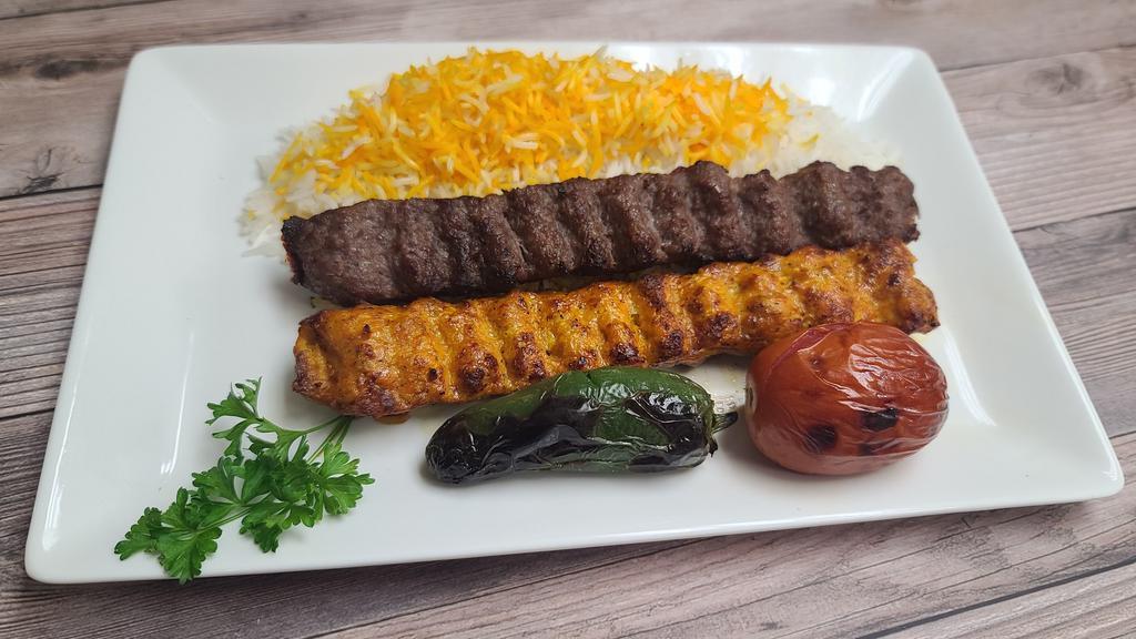 #3 Mix Lule Kebab Plate · Seasoned mix of ground chicken and ground beef/lamb grilled on open flame.
Comes with grilled tomato, spicy pepper, salad, rice,
choice of side of hummus or baba ganoush, a choice of dipping sauce and special home made bread.