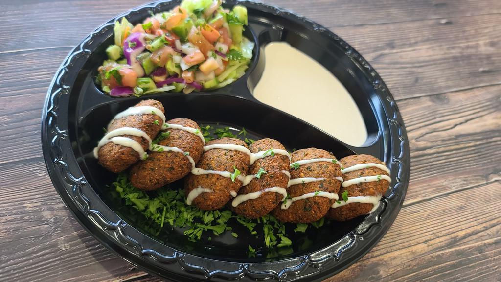 Falafel Plate · Vegetarian patties made from garbanzo beans and spices. Comes with tahini, hummus, salad and a pita bread.