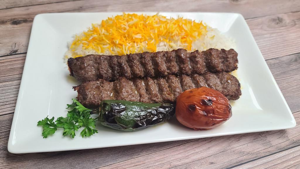 #1 Beef Lule Kebab Plate · Seasoned mix of ground meat/lamb grilled on open flame.
Comes with grilled tomato, spicy pepper, salad, rice,
choice of side of hummus or baba ganoush, a choice of dipping sauce and special home made bread.