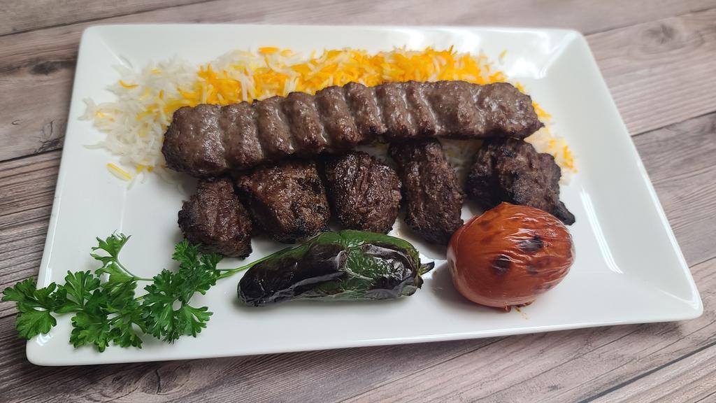 #14 Beef Shish Combo · Chunks of marinated flap meat kebab grilled on open flame. comes with grilled tomato spicy pepper salad rice choice of side of hummus or baba ganoush a choice of dipping sauce and special home made bread.