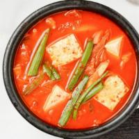 Kimchi Stew · Hot and spicy Kimchi stew.  (Includes 1 serving of white rice and seasonal side dishes per o...