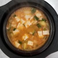 Bean Paste Stew (된장찌게) · Bean paste stew with tofu and vegetables. (Includes 1 serving of white rice and seasonal sid...
