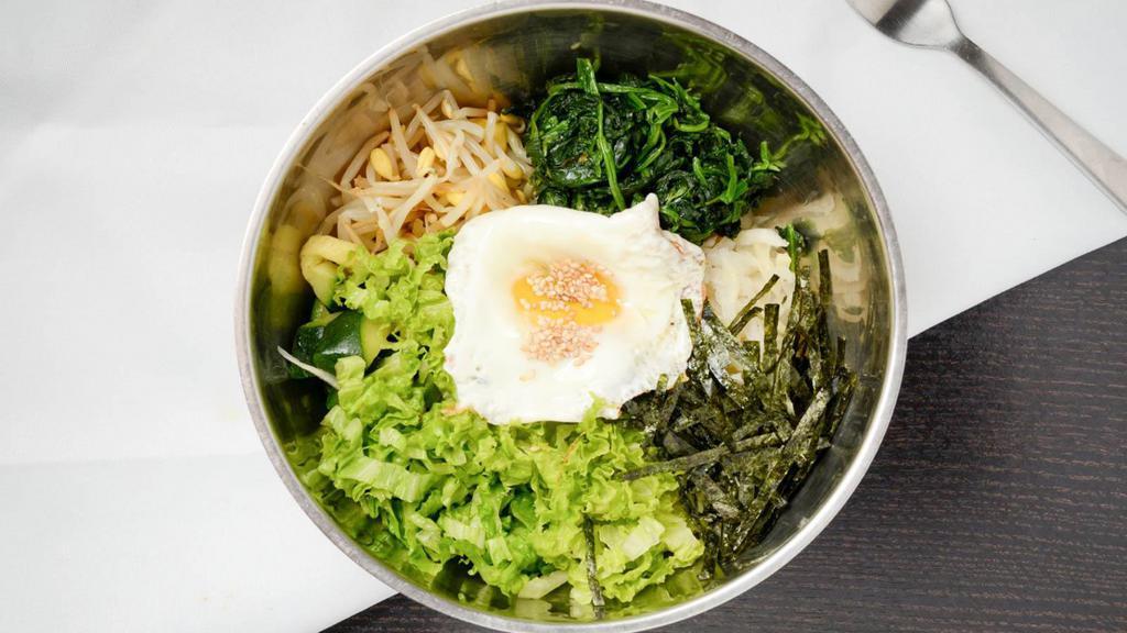 Bibimbap (비빔밥) · Steamed rice with assorted vegetables.  (Includes seasonal side dishes per order)