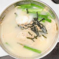 Dumpling Soup With Rice Cake (떡만두국) · Rice cake and dumpling soup. (Includes seasonal side dishes per order)