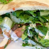Chicken Shawarma · Your choice of bread, garlic spread, pickles, and chicken shawarma.