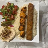 Chicken Tikka & Kabab · The Tikka Kabob combo comes with salad, hummus, pita bread, rice, 1 skewer of tikka and 1 ka...