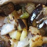 Eggplant Mania Pita · Mixed greens, eggplant hummus, fried eggplant, egg, chopped salad, tahini sauce