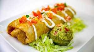 Shredded Beef · A deep fried burrito with meat, beans and rice inside, with guacamole, sour cream and cheese...