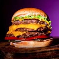 Signature Triple Burger · Triple 4 oz. Beef Patties, Grilled Onions, 3 slices of American Cheese, Classic Sauce, Pickl...