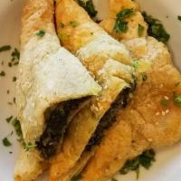 Spanakopita Of Athens · Spinach, feta cheese, Greek olive oil, rolled in phyilo dough and baked.