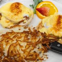 Classic Eggs Benedict · English muffin, seared Canadian bacon, poached eggs, and homemade Hollandaise; accompanied w...