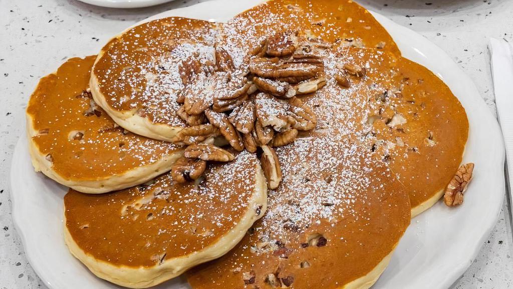 Georgia Pecan Pancakes · Tender Georgia pecans inside and out; sprinkled with powdered sugar and whipped butter.