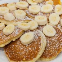 Banana Pancakes · Ripe bananas griddled into pancakes and then topped with more sliced bananas; lightly dusted...