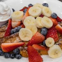 San Diego French Toast · Grilled until golden brown and garnished with the freshest sliced bananas, strawberries, and...