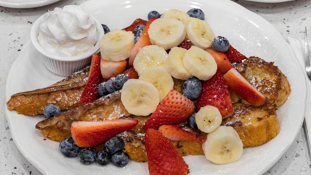 San Diego French Toast · Grilled until golden brown and garnished with the freshest sliced bananas, strawberries, and blueberries; real whipped cream on the side.