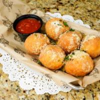 Famous Cheeseballs · 6 pieces. Alondra’s famous dough, stuffed with melted mozzarella cheese, tossed in garlic Pa...
