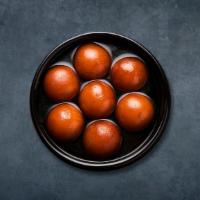 Gourmet Gulab Jamun · Soft cottage cheese dumplings steeped in rose and saffron syrup
