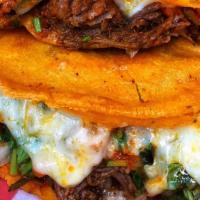 Quesataco · Crispy hand made corn tortilla taco with melted cheese and you can add the meat of your choi...
