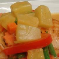 *Pineapple Salmon Curry · Spicy. Grilled fillet of salmon topped with a rich red curry sauce and pineapple.