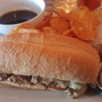 Cali-Cheese Steak Sandwich · Tender roasted tri-tip, grilled peppers, pepper jack on a French roll, served with au jus.