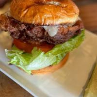 The Kick'N Mule Burger · 8oz fire grilled beef patty, topped with roasted  jalapeños, lettuce, tomatoes, onion, bacon...