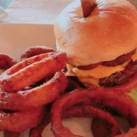 Tower Bridge Burger · 8 oz fire grilled beef patty, cheddar, lettuce, tomatoes, topped with onion rings, and BBQ s...