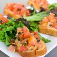 Bruschetta · Vegetarian. Toasted bread, topped with tomatoes, light garlic and basil.