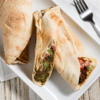 Falafel · A blend of garbanzo beans, onions, cilantro, parsley, garlic, and spices, fried with a side ...