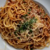 Spaghetti · Spaghetti tossed in porcini and meat sauce.
