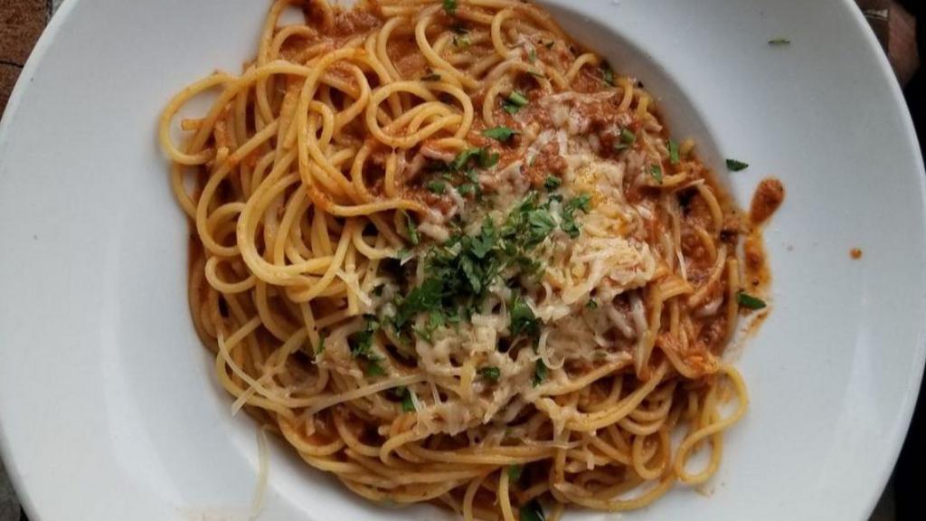 Spaghetti · Spaghetti tossed in porcini and meat sauce.
