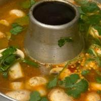 Tom Yum Talay · Spicy and sour soup with shrimp, scallop, squid, fish, mussel, cilantro and mushroom.