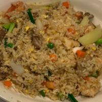 Combination Fried Rice · Chicken, beef, pork and shrimp with egg, onion, tomato and pea and carrot.