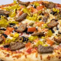 Greek Pizza · Black olives, green olives, tomato, gyro meat, pepperoncinis, feta cheese & mozzarella cheese
