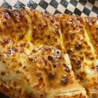 Pepperoni Calzone · 100% Mozzarella Cheese, Pepperoni and our house red pizza sauce.
