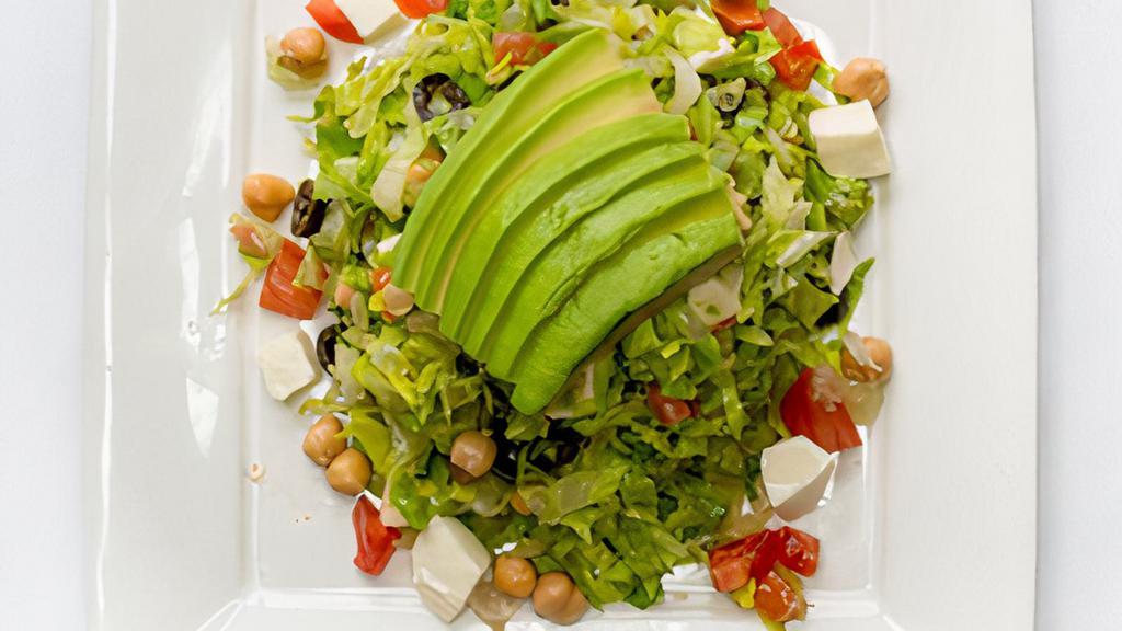 Chopped Salad · Chopped lettuce, garbanzo beans, tomatoes, avocado, mozzarella and olives tossed in a vinaigrette dressing