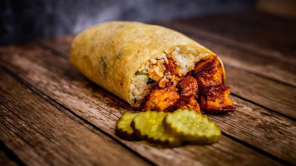Nashville Hot Chicken Burrito · Crispy chicken, signature Nashville hot sauce, pickles, seasoned white rice rolled in a warm flour tortilla. BOOYAH!