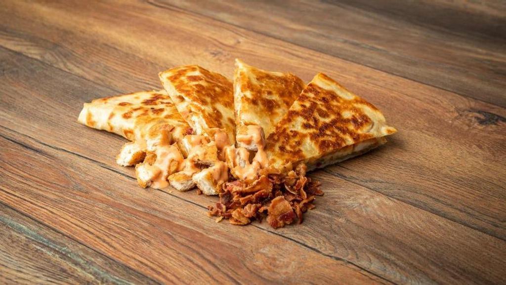 Crispy Chicken Bacon Sriracha Ranch Quesadilla · Don't miss out on the flavors of the Crispy Chicken Bacon Sriracha Ranch Quesadilla!