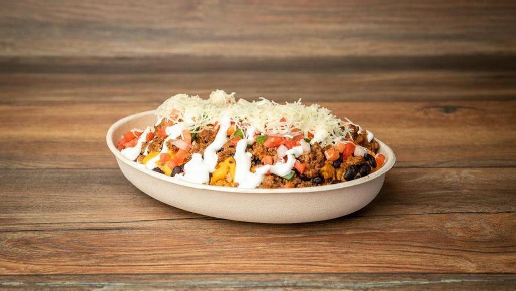 Buffalo Beef Chiwawa · A Chiwawa creation that you do not want to pass on! Served with nacho cheese, buffalo ground beef, salsa, jalapeno, sour cream and cheese.